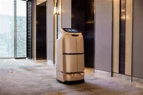 Delivery robot waiting at a lift lobby for AGV-integrated lift access